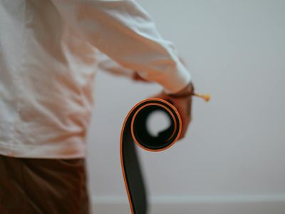 Yoga mat rolled up in a corner of a room